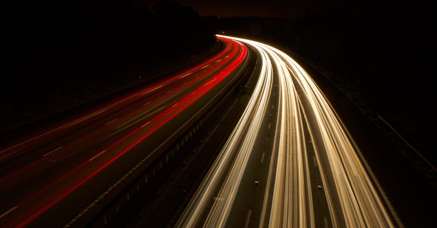 lights curving through the darkness, illustrating the concept of electrical impedance control in circuit design