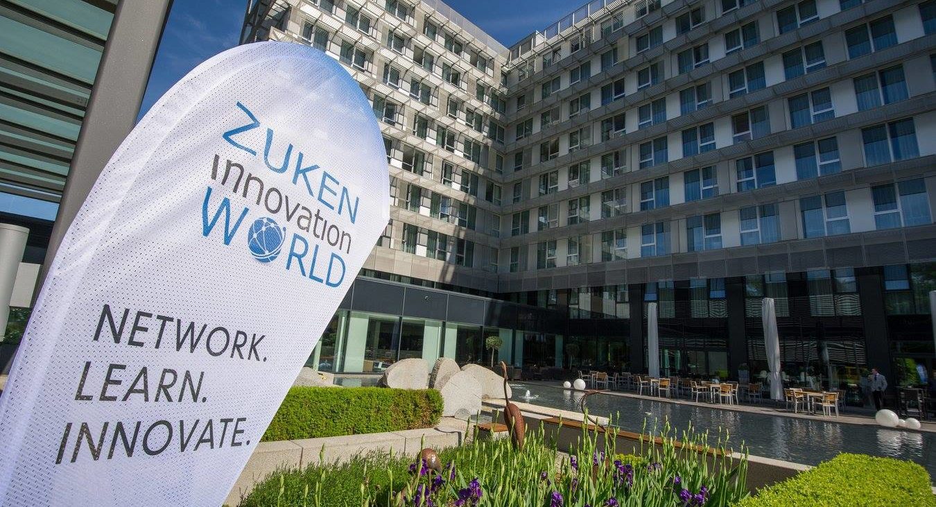 A promotional banner for Zuken Innovation World, highlighting the venue for a technology conference focused on networking, learning, and innovation
