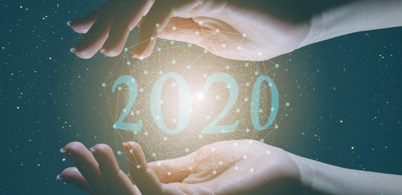 Open hands cradling the year 2020, evoking a sense of anticipation and wonder for the future in the context of harness building technology and E3.series