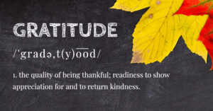 Chalkboard with the word Gratitude, followed by the pronunciation and the definition