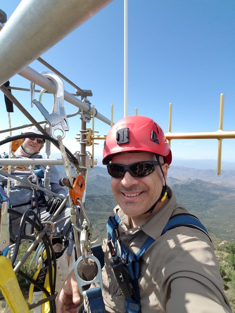 Man atop a radio tower. Meet Mike Applications Engineer, Zuken