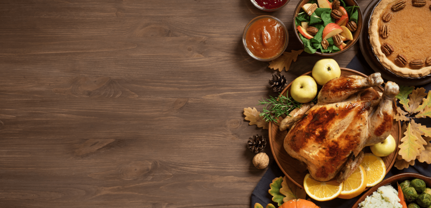 Thanksgiving table with Turkey, pumpkin pie, and salad