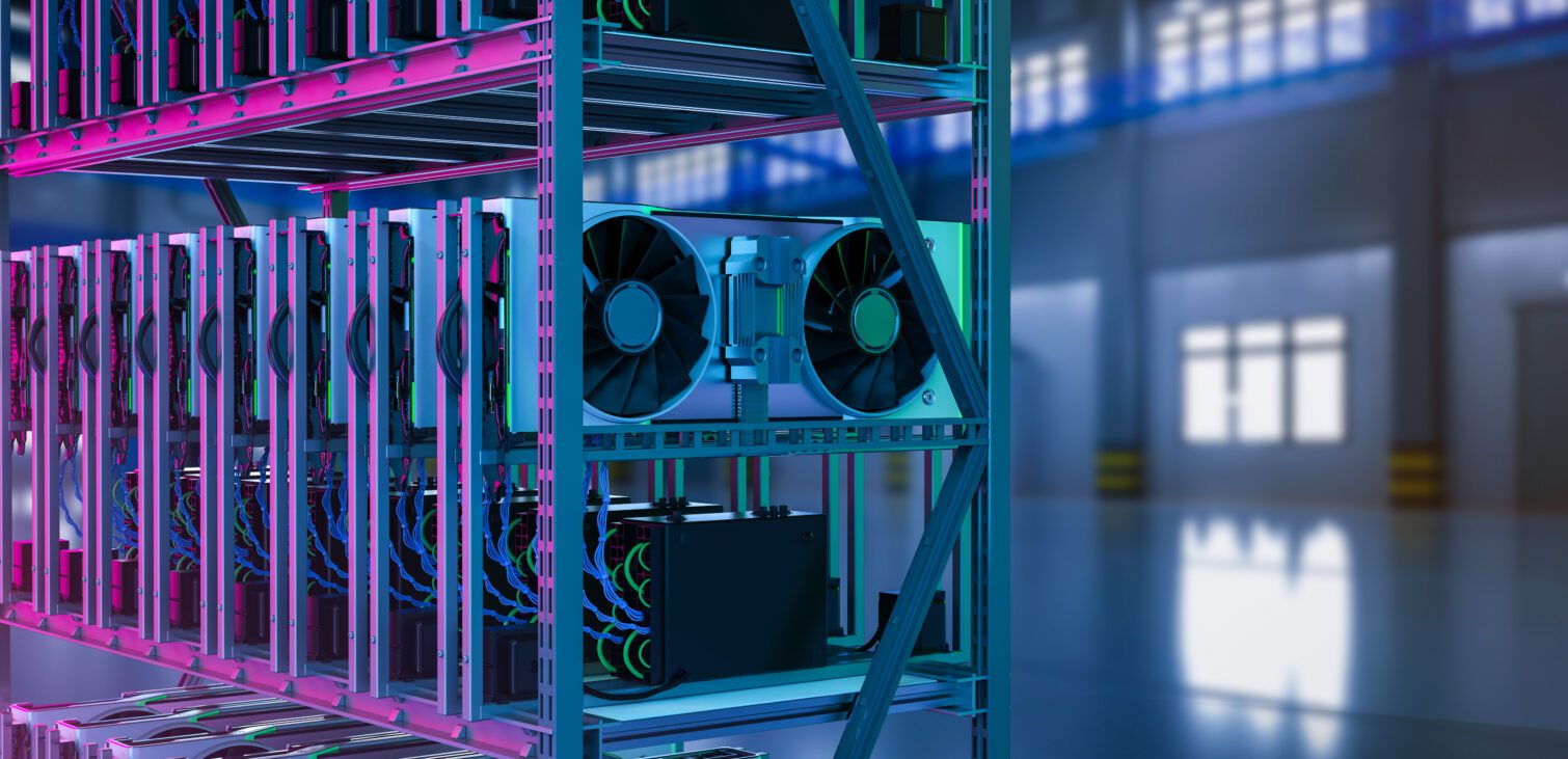 A rack containing multiple rows of GPUs in moody purple and blue light.