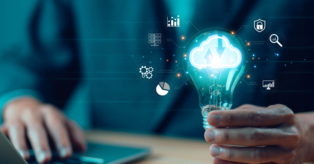 Man holdling a lightbulb with a cloud inside it. Icons around the bulb indicating different areas for cloud computing. Zuken. Engineering Data Management.
