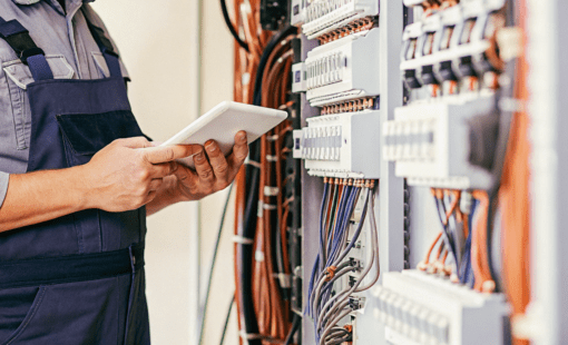 an-electrical-technician-working-at-a-group-of-swi-1-510x310