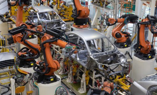 Car bodies on an assembly line. A factory for the production of cars. Modern automotive industry. Electric car factory, conveyor.
