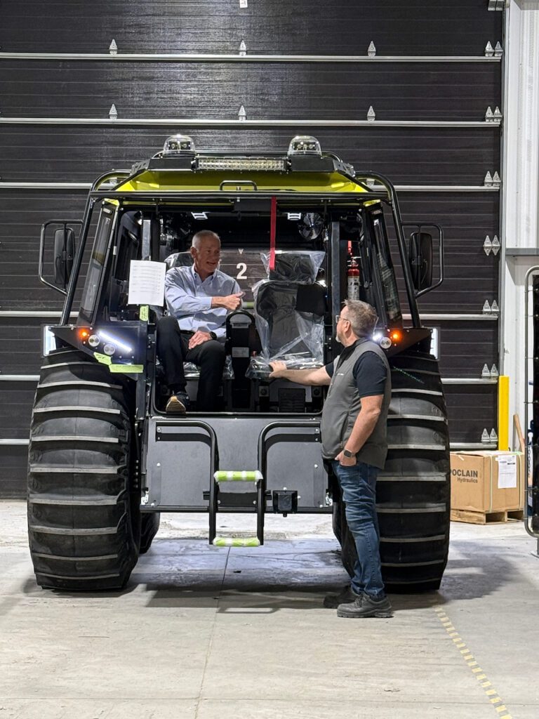Bob Potock seated inside a Fat Truck speaking with Joël Blackburn at Zeal Motors