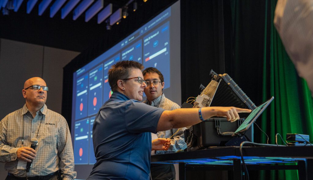 Presenters demonstrating the Dashboard tool during a hands-on mini panel assembly session at ZIW 2026.
