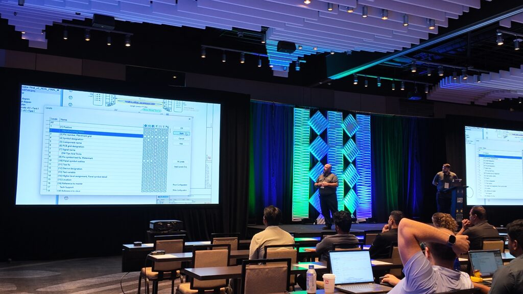 Mike Bayliff and Brian Atwater presenting together on stage at Zuken Innovation World 2026.